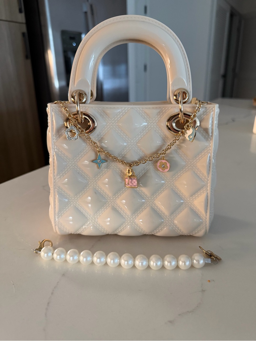 Ivory Quilted Patent Top-Handle Kids Bag with Charm Chain